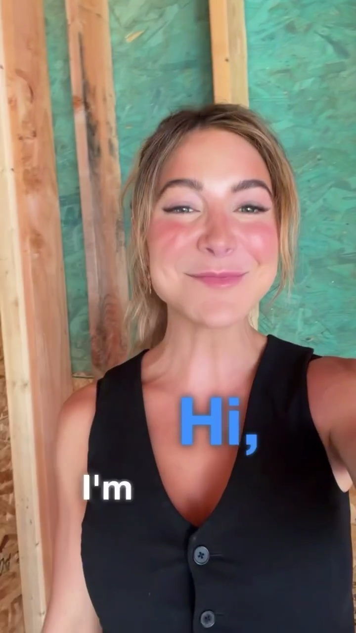 Kelly with Backyard Pod, smiling and saying hi in a backyard pod being built